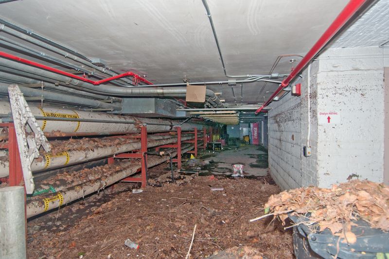 Basement interior after flooding with wet floors and debris